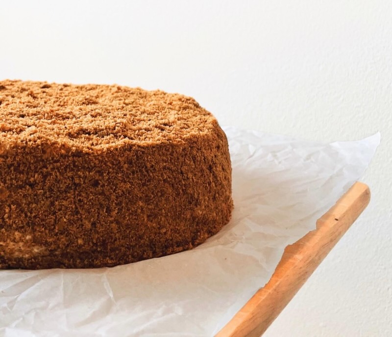 Golden honey cake on a rustic plate with honey drizzle