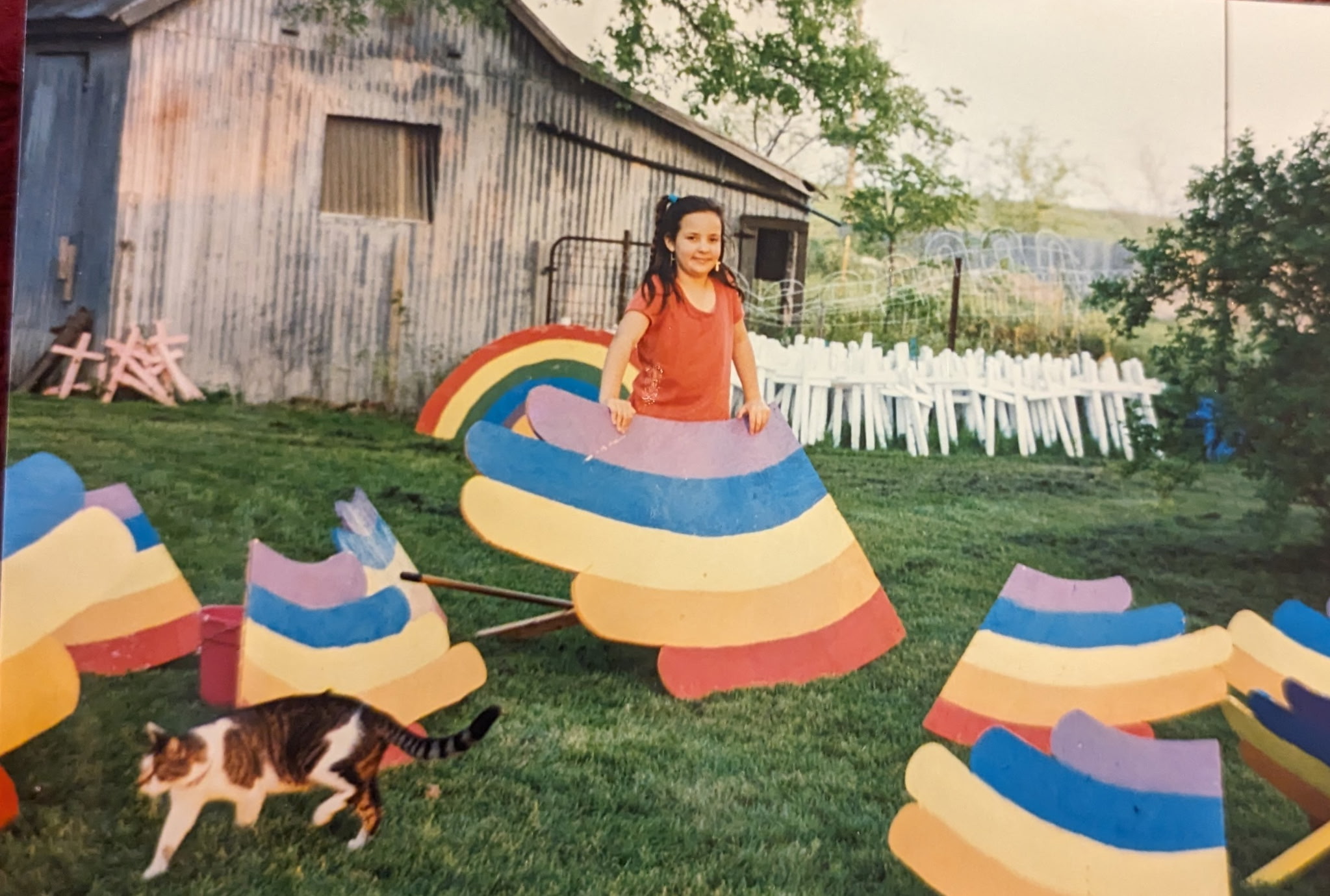 Girl holds a rainbow sign in 1993 Field of Hope
