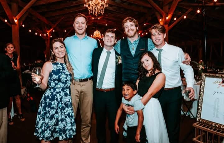 Sydney Opera House glowing at sunset from the harbor