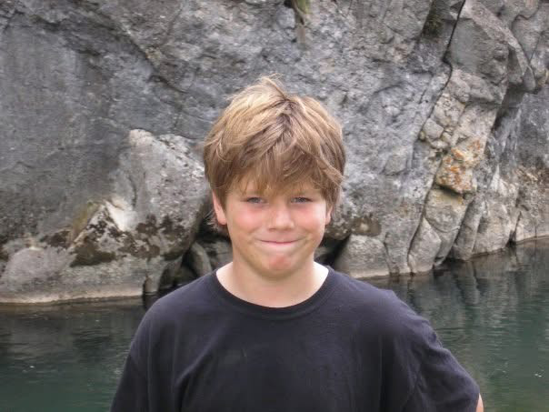 Sydney Opera House glowing at sunset from the harbor