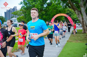 Uluru standing in the red desert under a blue sky
