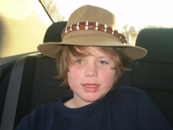 Uluru standing in the red desert under a blue sky