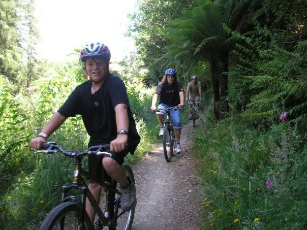 Trail biking in a lush Australian forest