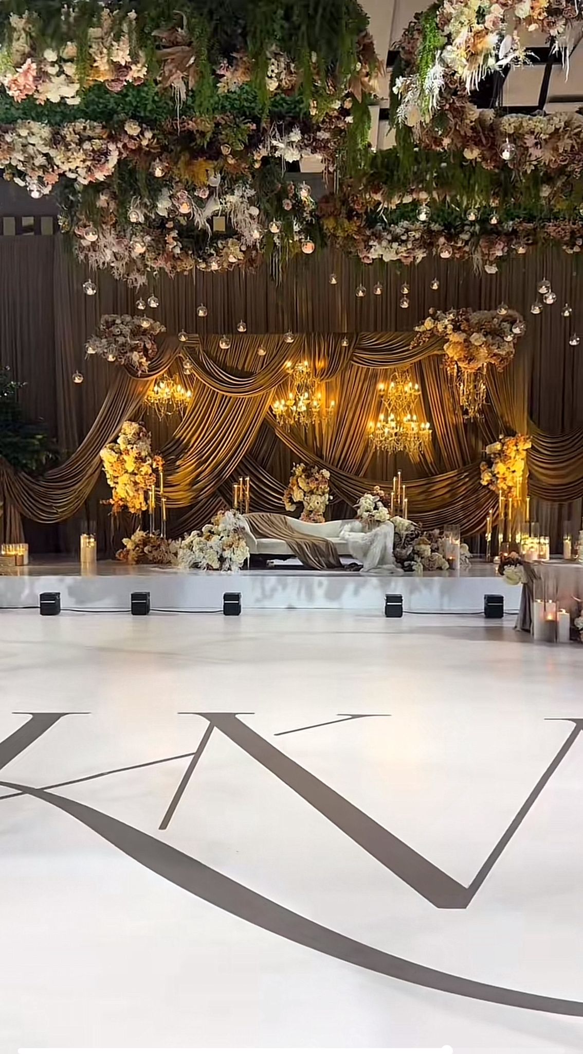 Elegant gold-themed wedding decor with candles and luxe accents