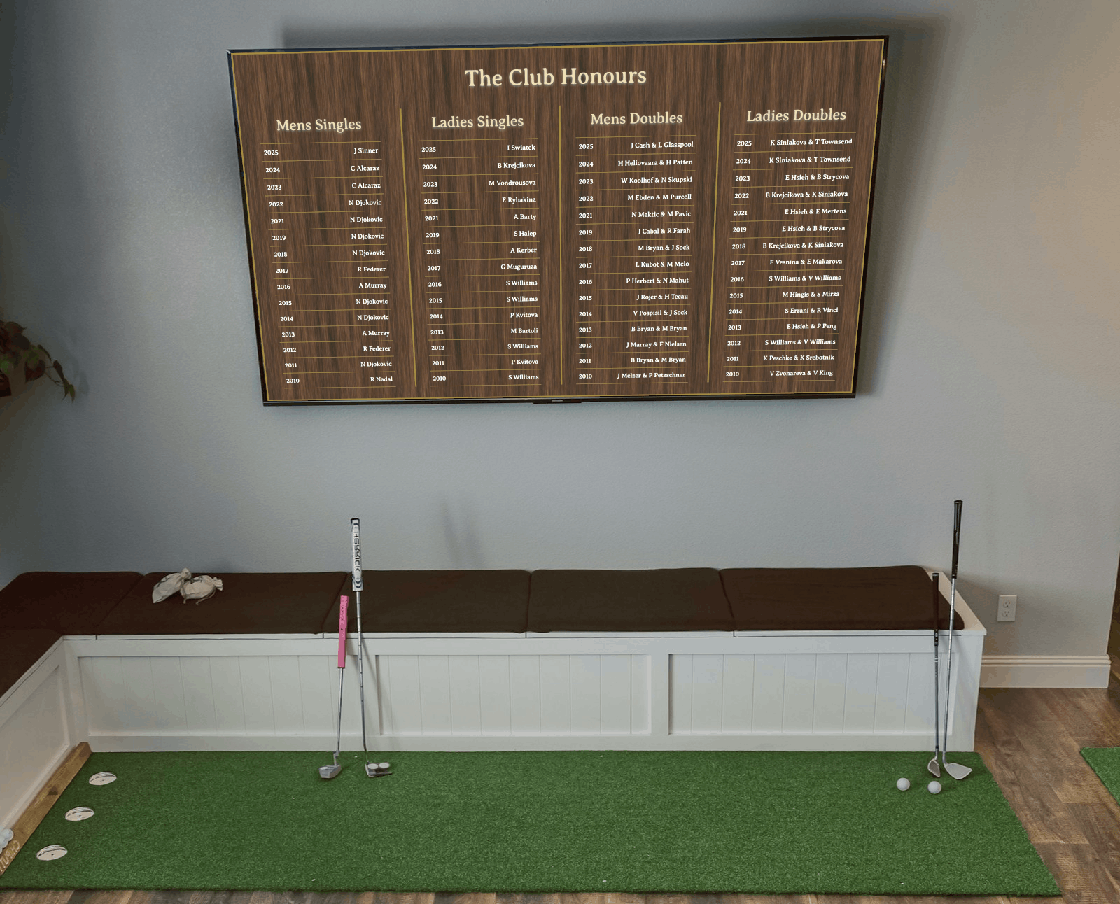 Honours board mounted above timber seating in a hospitality-style club room
